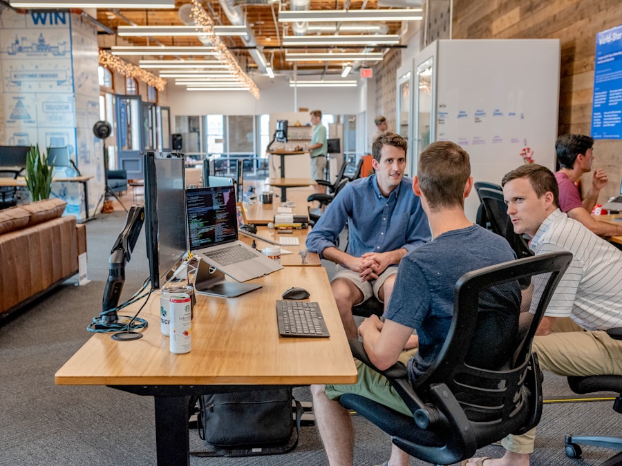 Software team collaborating at their workstations while an application takes shape