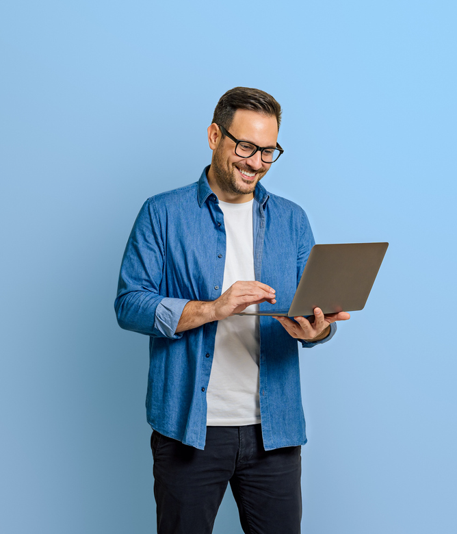 Man Smiling at Laptop